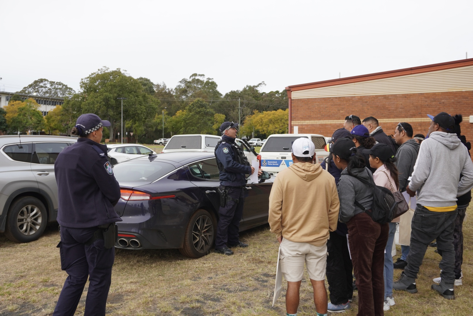 Image of workers participating in information session by Queensland Police Services