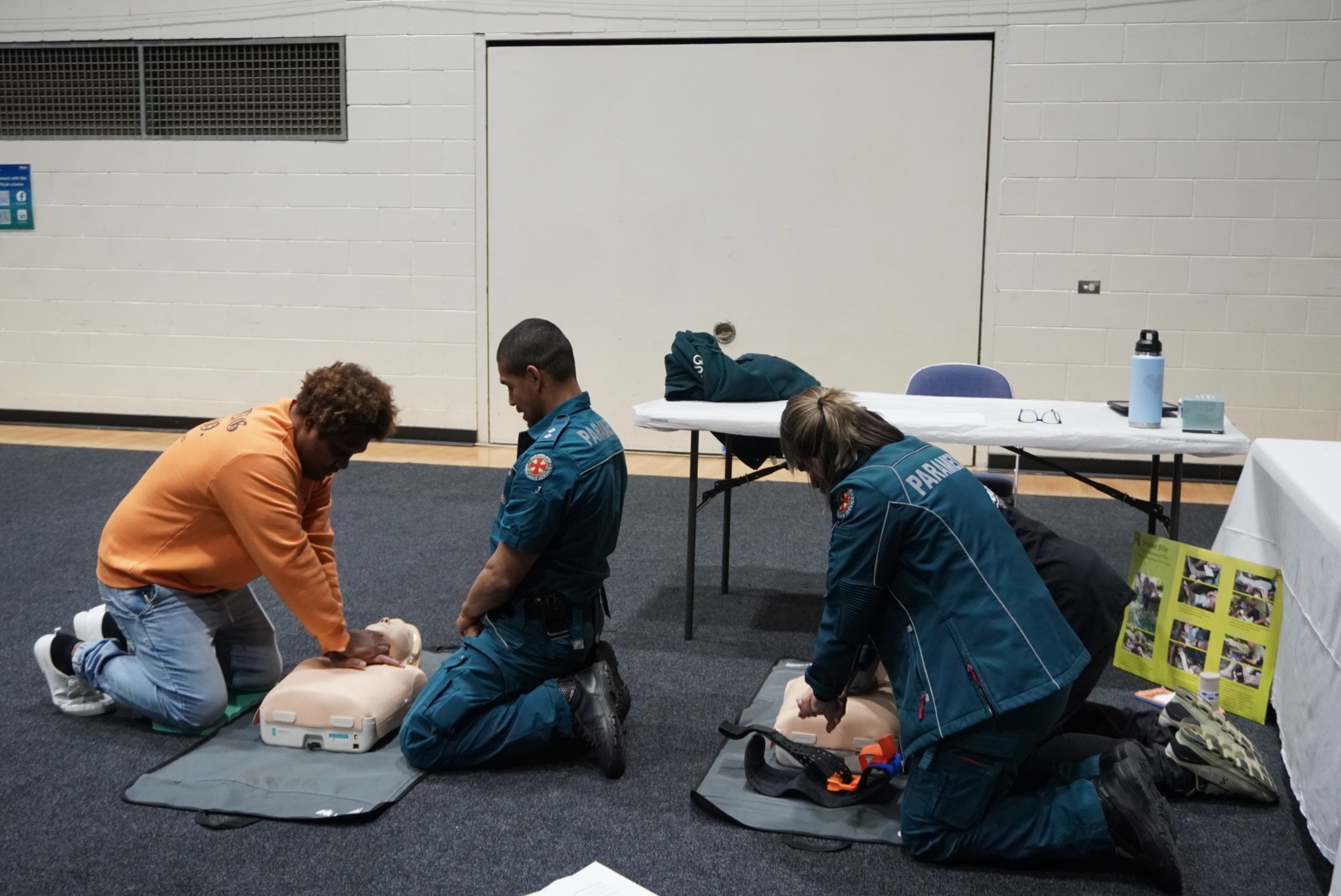 Image of workers participating in information session by Queensland Ambulance Services