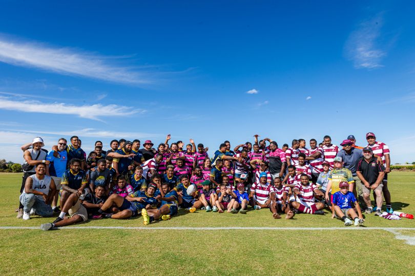 Image of PALM scheme workers and local community at sporting event
