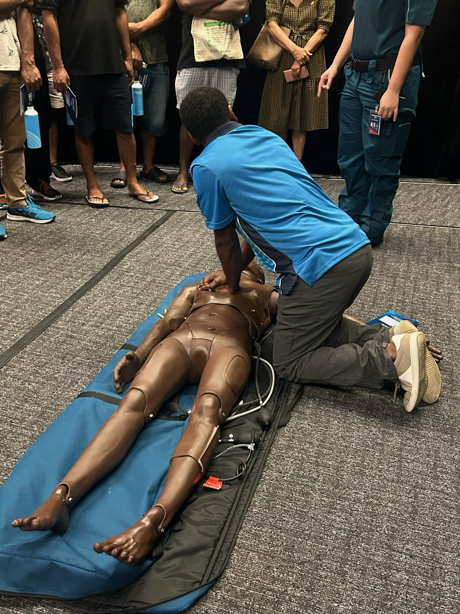Image of PALM scheme worker practicing CPR 