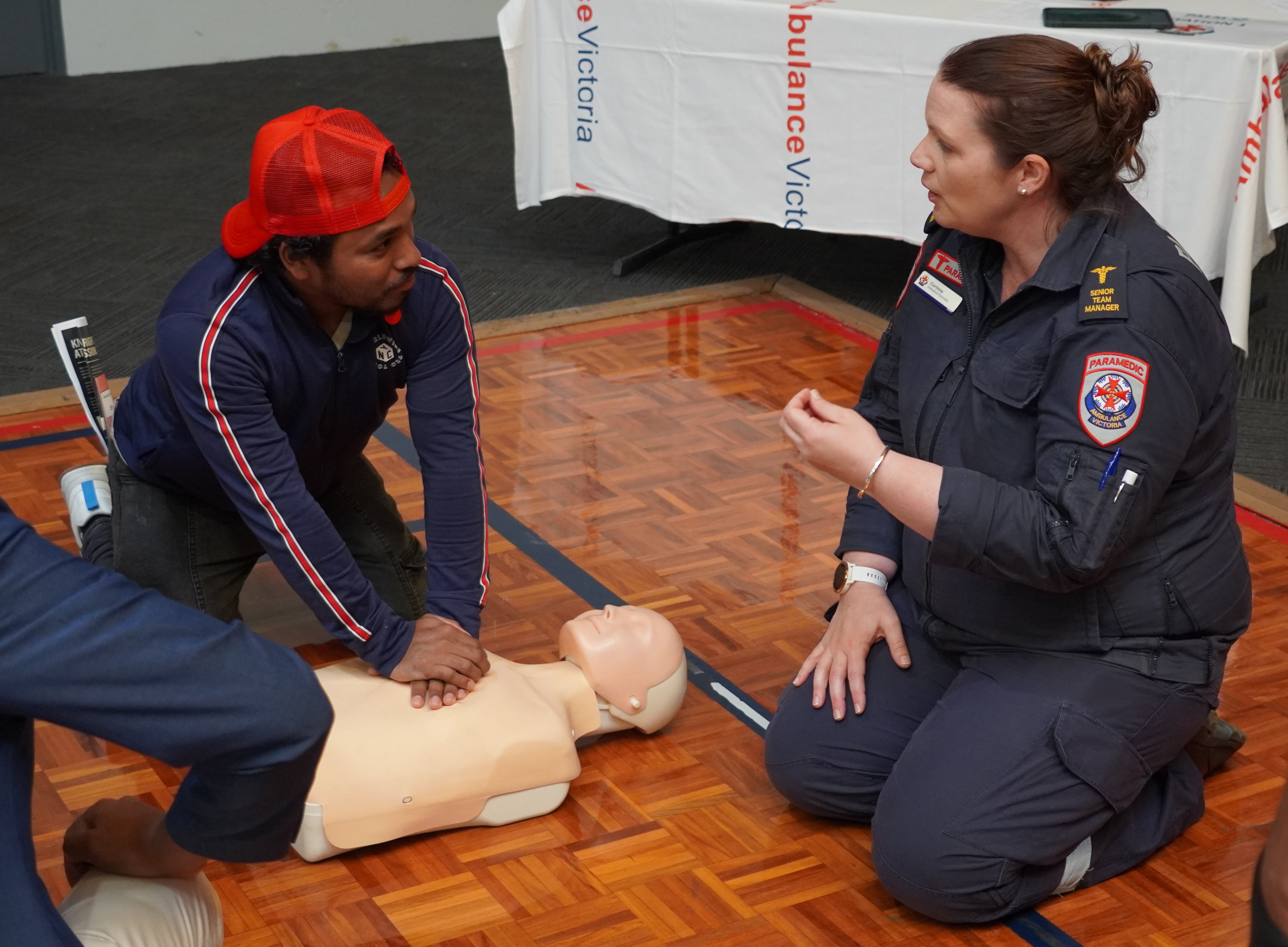 Ambulance Victoria Paramedic teaches CPR to PALM scheme workers
