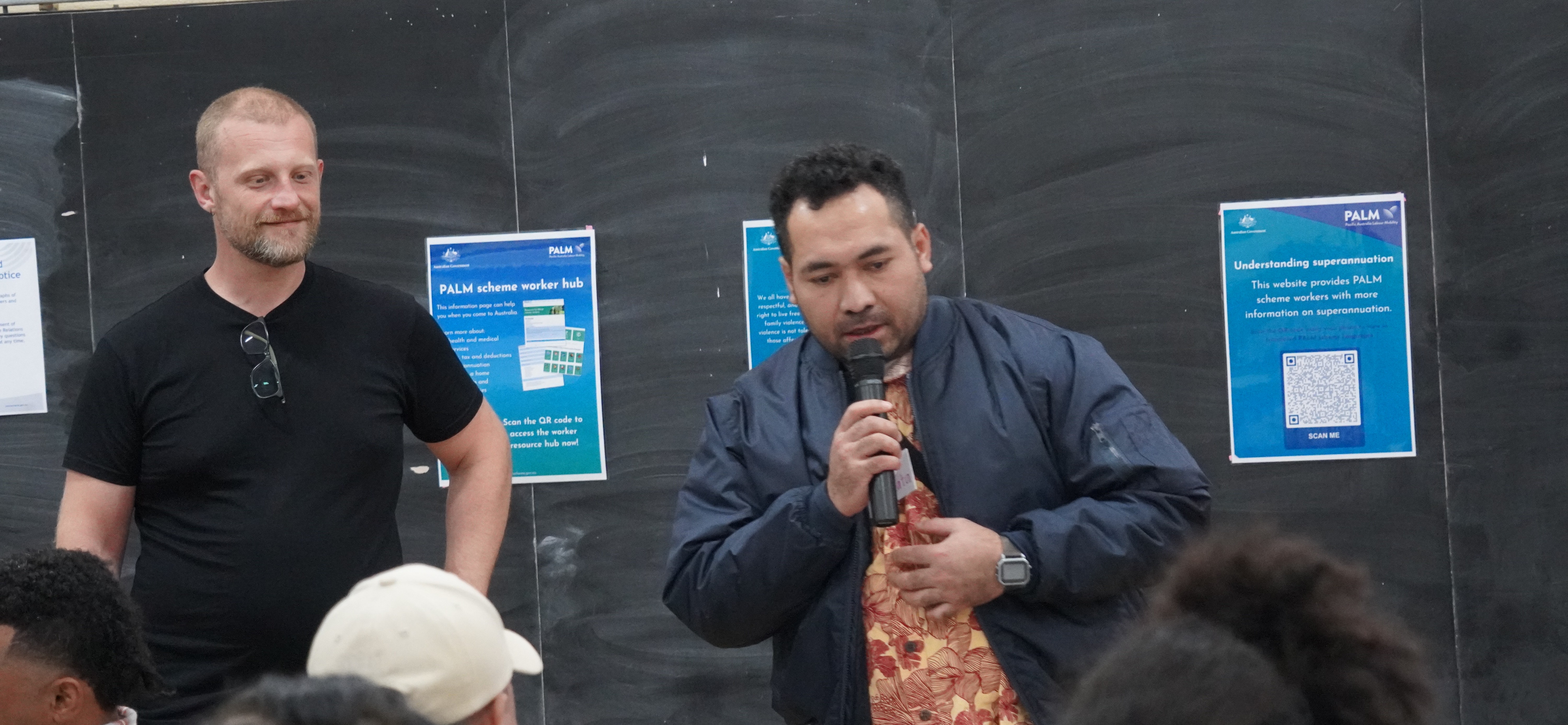 Two people speaking at the wellbeing presentation