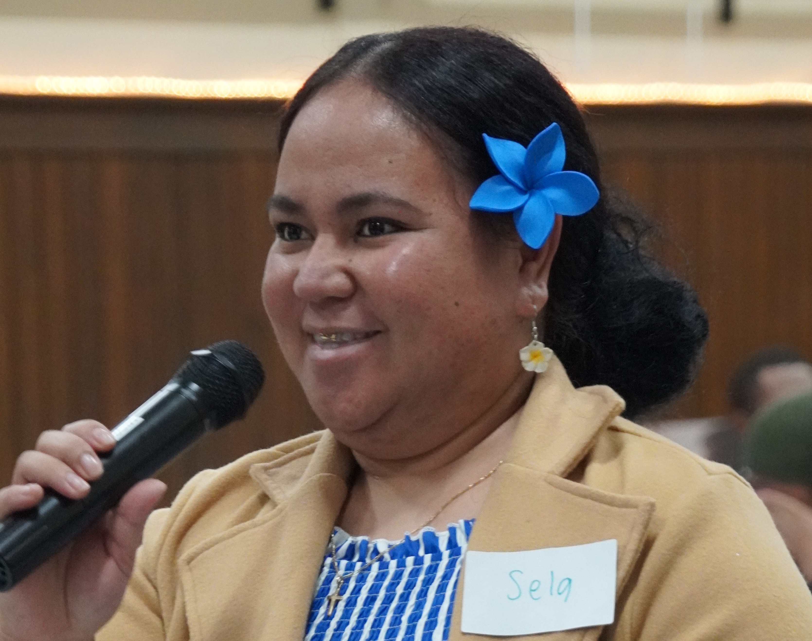 Smiling woman with microphone