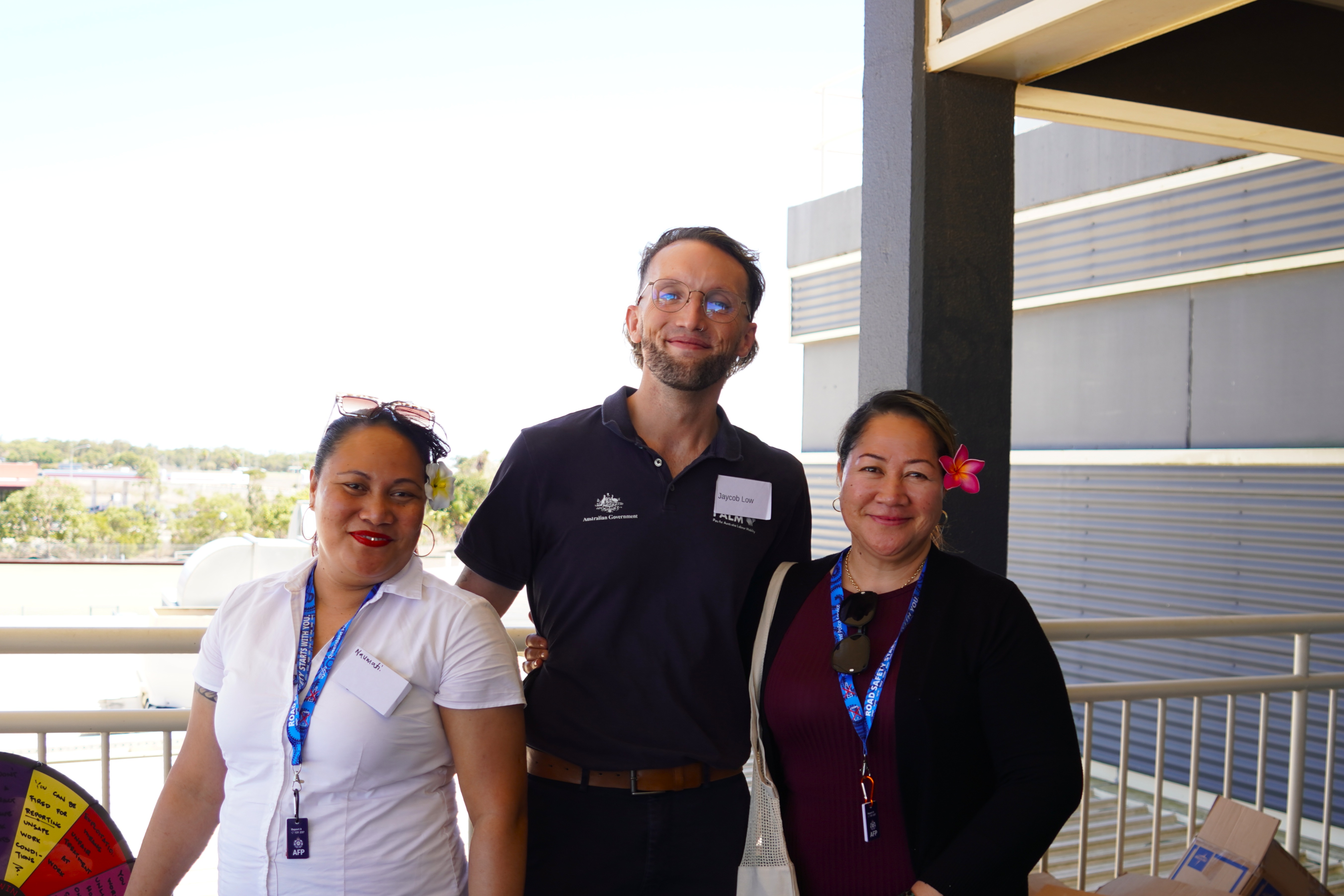 Image of DEWR staff member, Jaycob and PALM scheme workers
