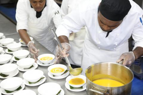 Pacific workers serving soup