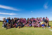 Image of PALM scheme workers and local community at sporting event